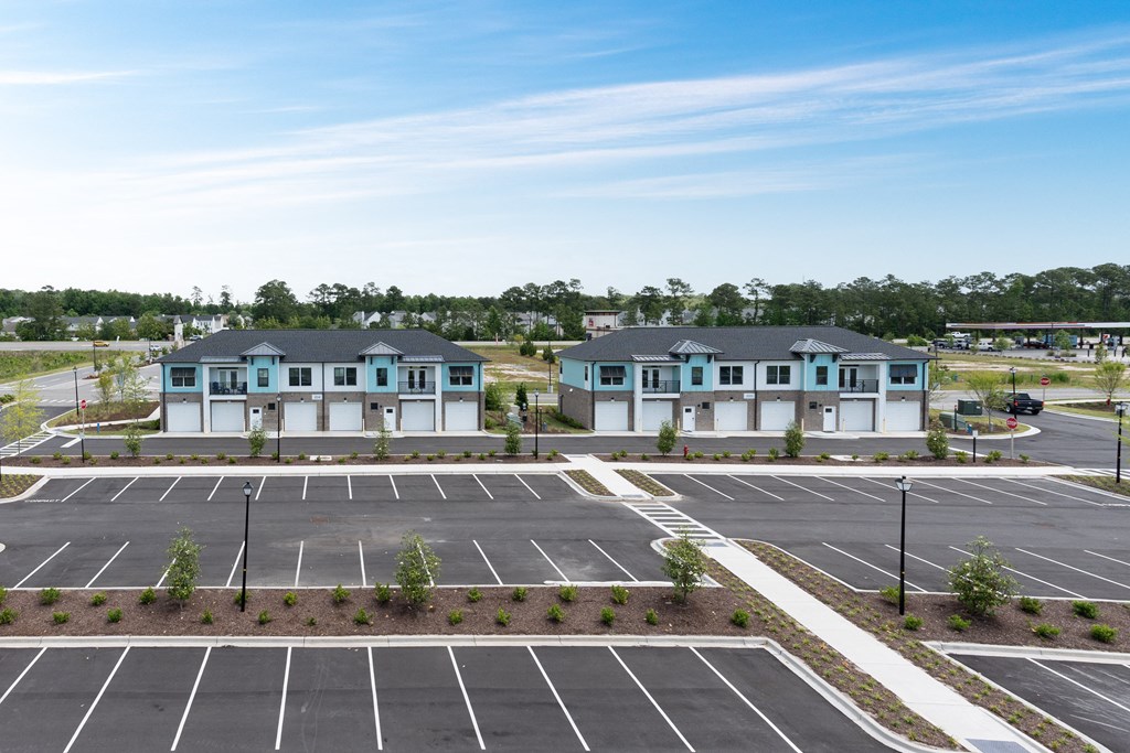 an empty parking lot at an apartment complex in a parking lot