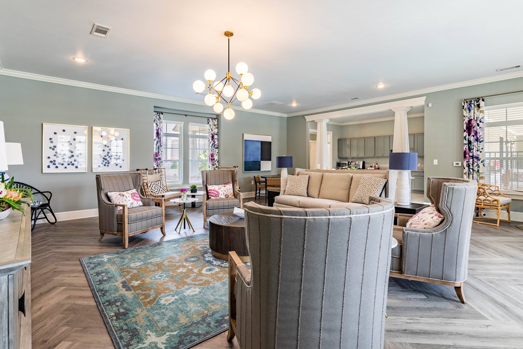 a living room with couches and chairs