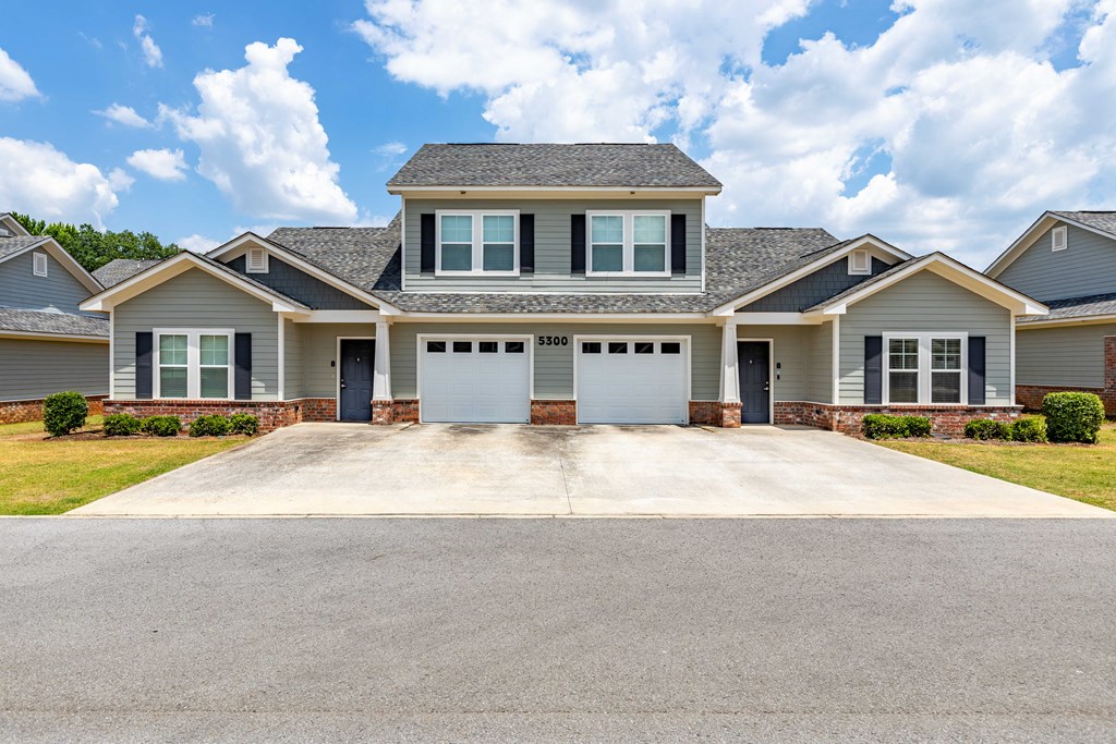a large house with a driveway in front of it
