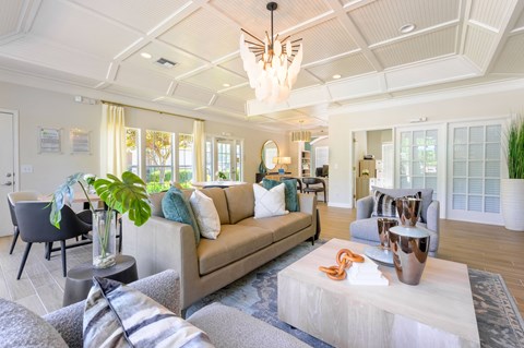 a living room with couches and chairs and a coffee table