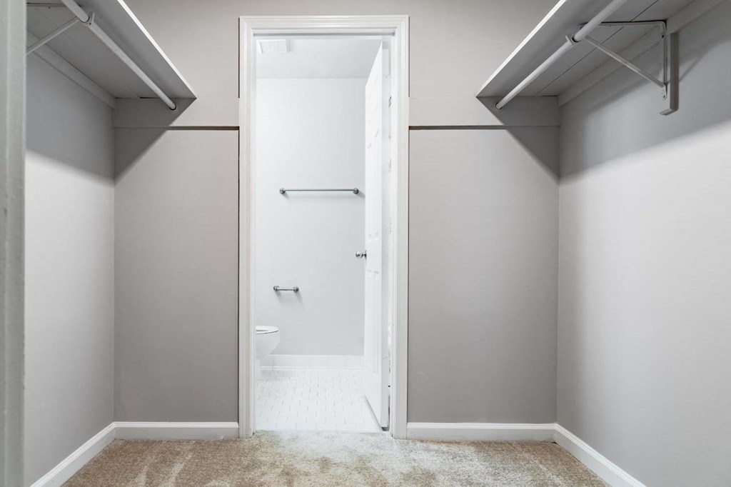 a bathroom with gray walls and a white toilet