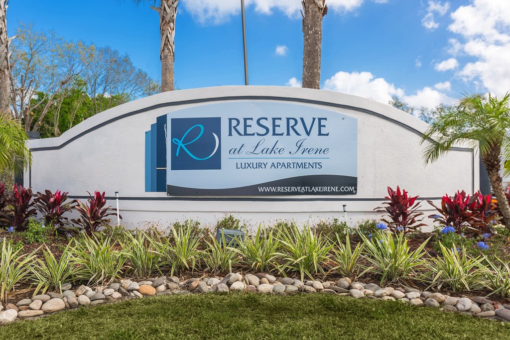 the reserve sign in front of plants and trees