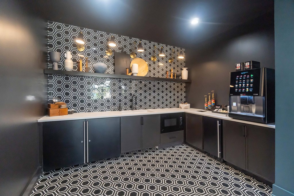 A black and white tiled kitchen with a counter and cabinets at Evolve Lake Norman apartments in Mooresville, NC