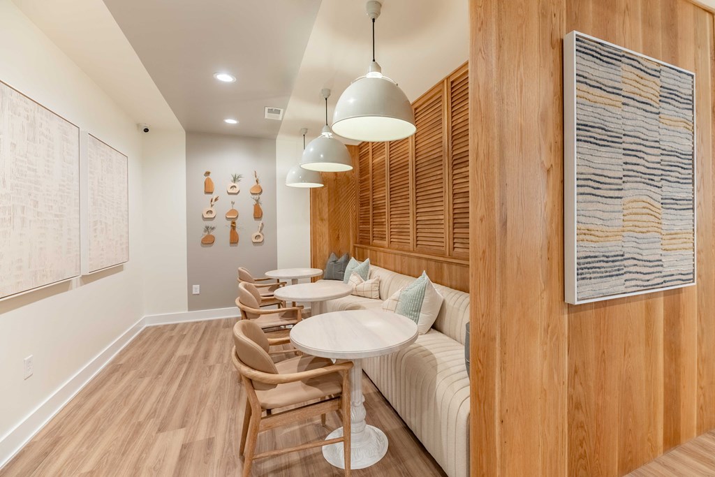 a living room with a couch and tables
