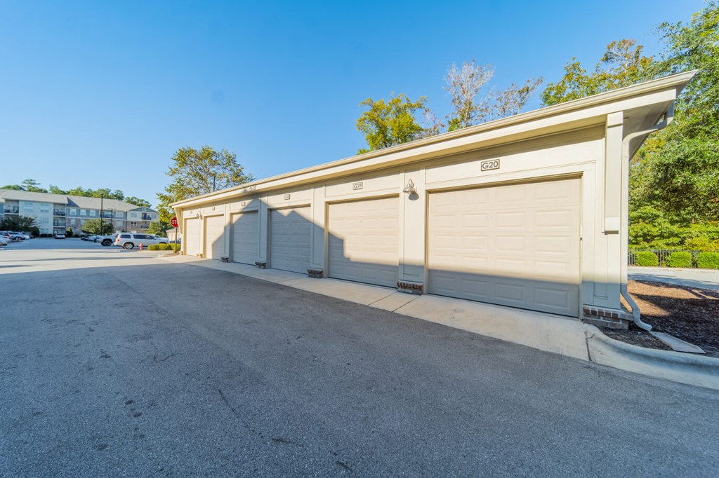 the garage at the end of the driveway of a parking lot