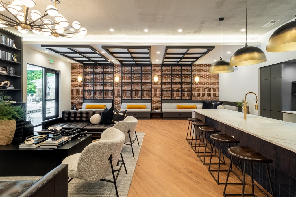 a living room filled with furniture and a large window