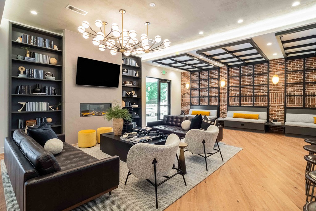 a living room with couches chairs and a fireplace