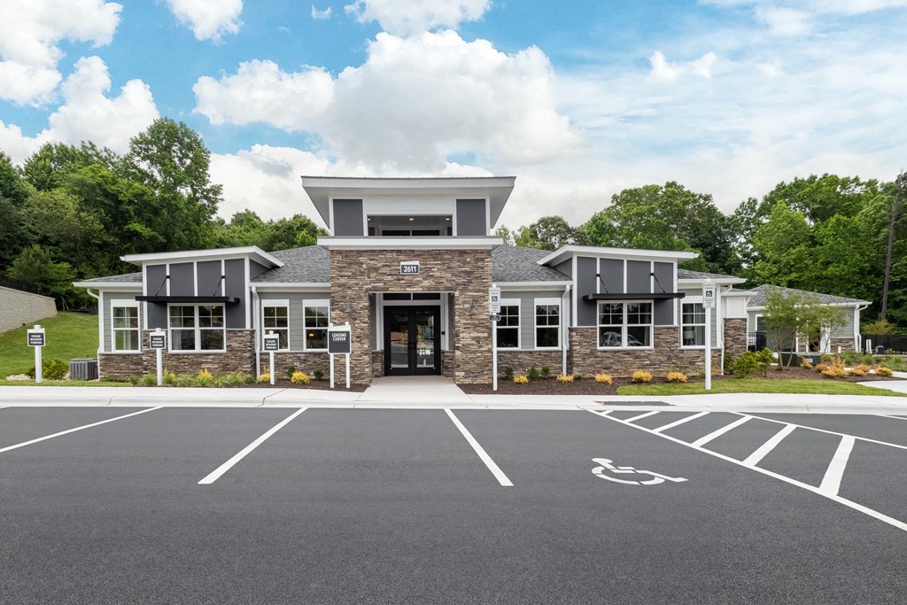 a large building with a parking lot in front of it