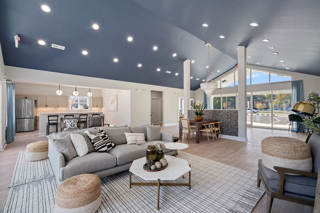 a living room with a gray couch and a table