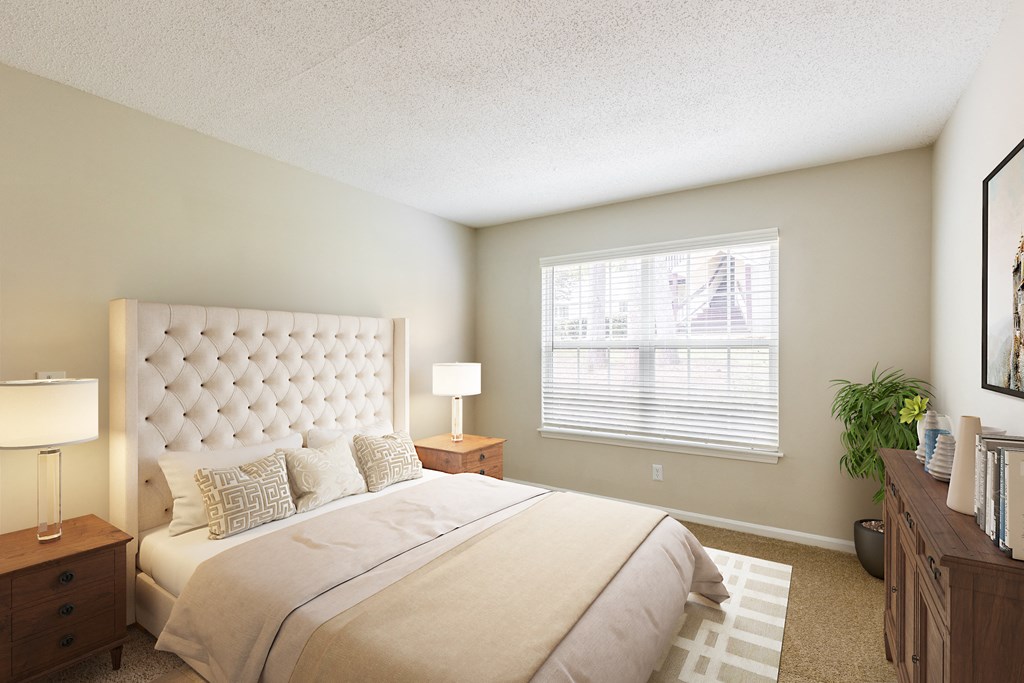 a bedroom with a large bed and two night stands
