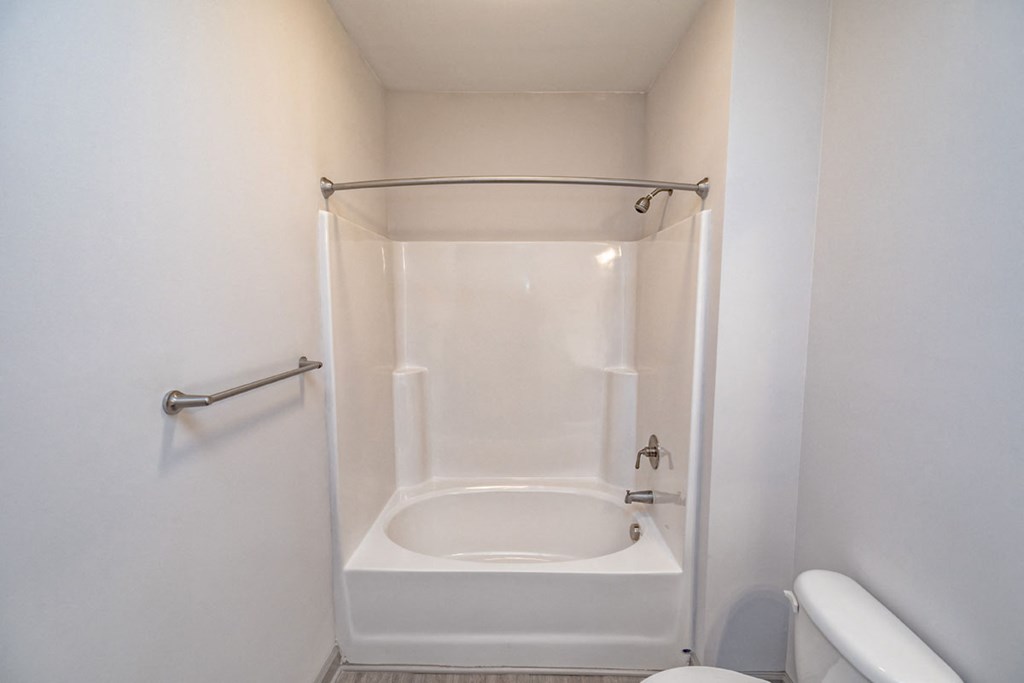 a small bathroom with a shower and a toilet