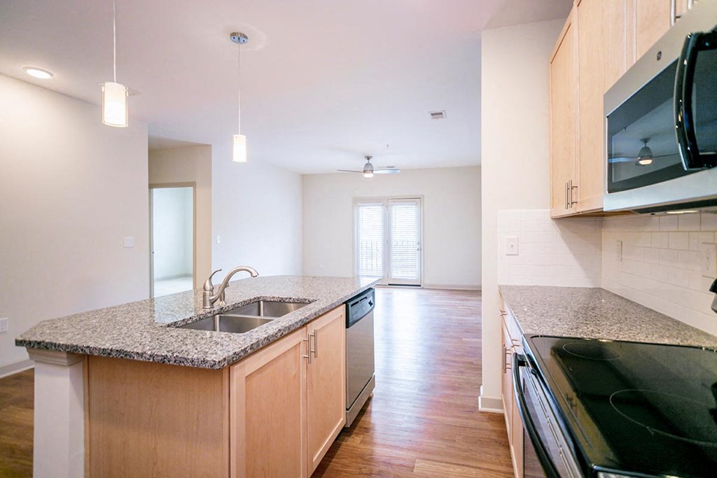 a kitchen with a sink and a counter top