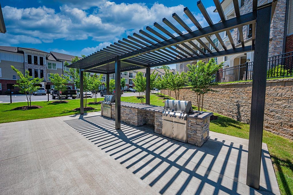 a patio with a seating area and a pergola