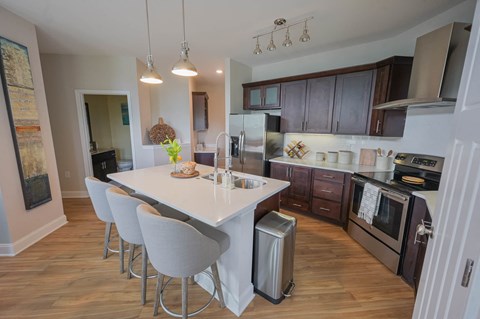 a kitchen and dining area with a white table and chairs