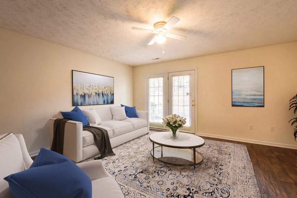 a living room with a white couch and a coffee table