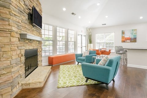 the preserve at ballantyne commons living room with couches and a fireplace