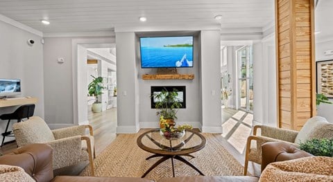 A living room with a television and a fireplace.