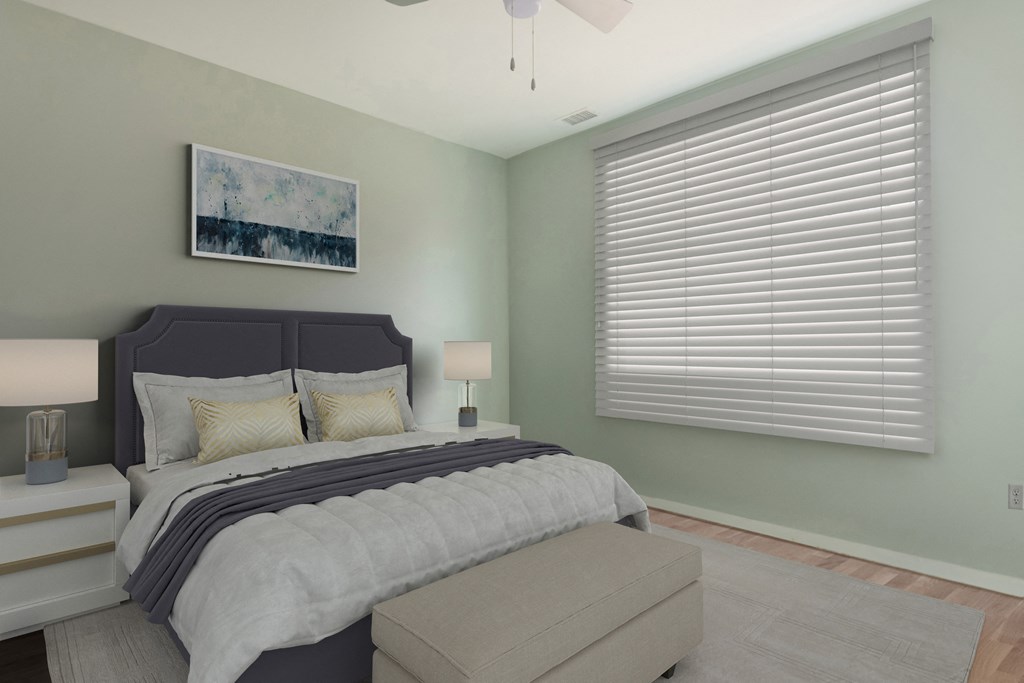a bedroom with a bed and a window with blinds