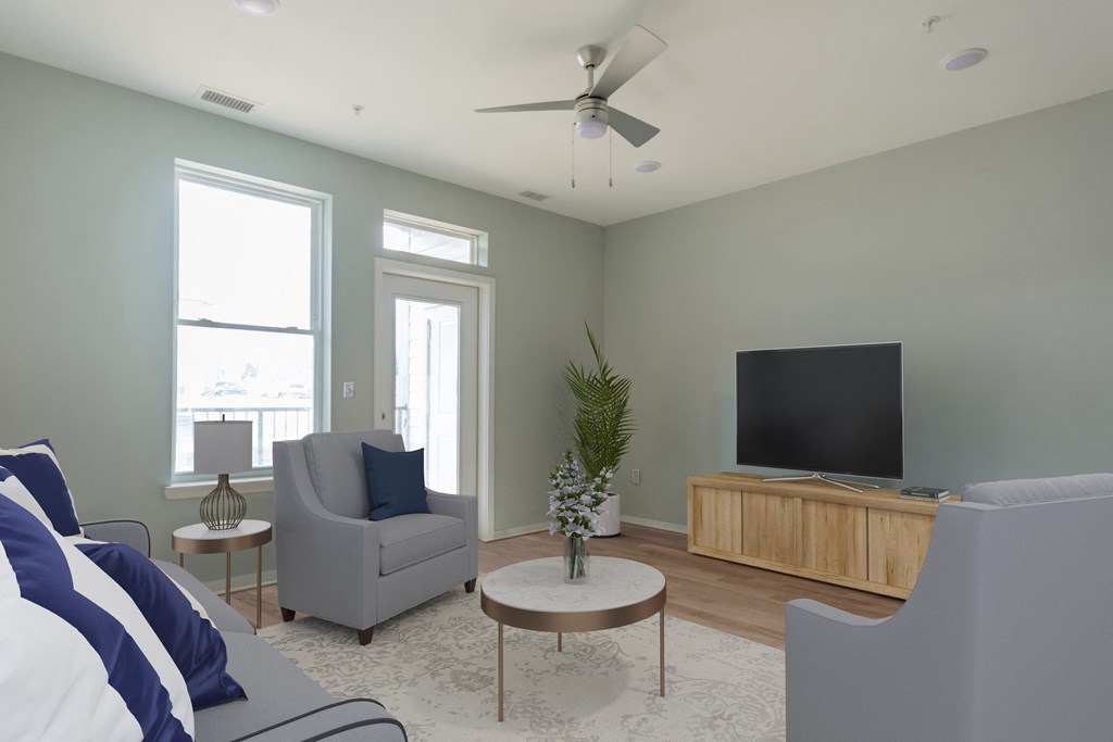 a living room with a couch and a tv