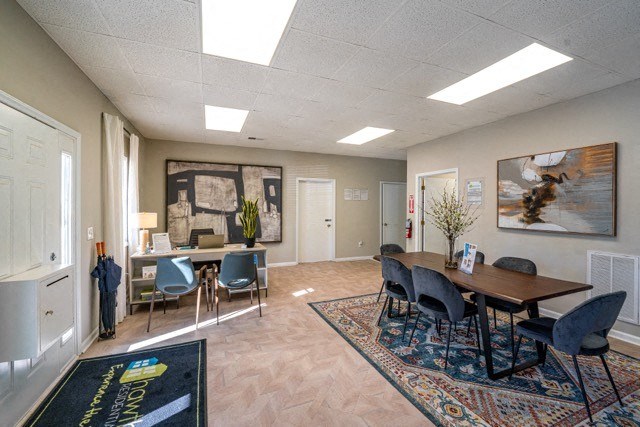 a conference room with a table and chairs