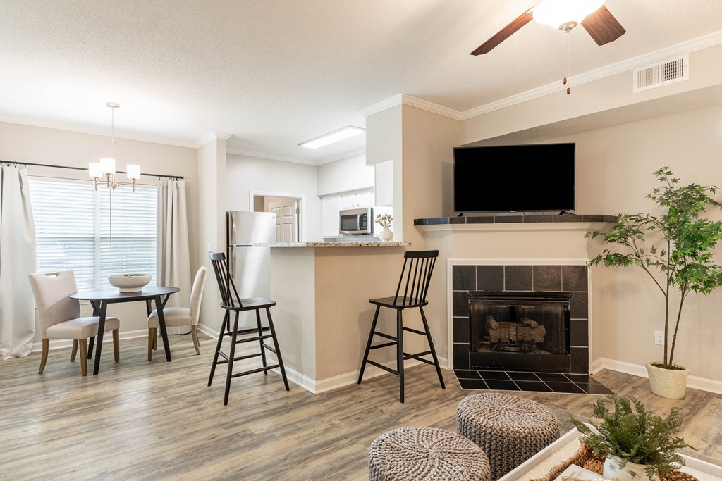 the preserve at ballantyne commons living room and dining room with fireplace