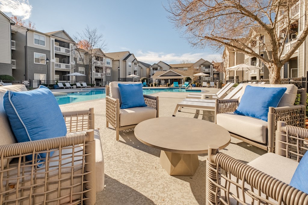 the preserve at ballantyne commons pool and patio area with chairs and tables