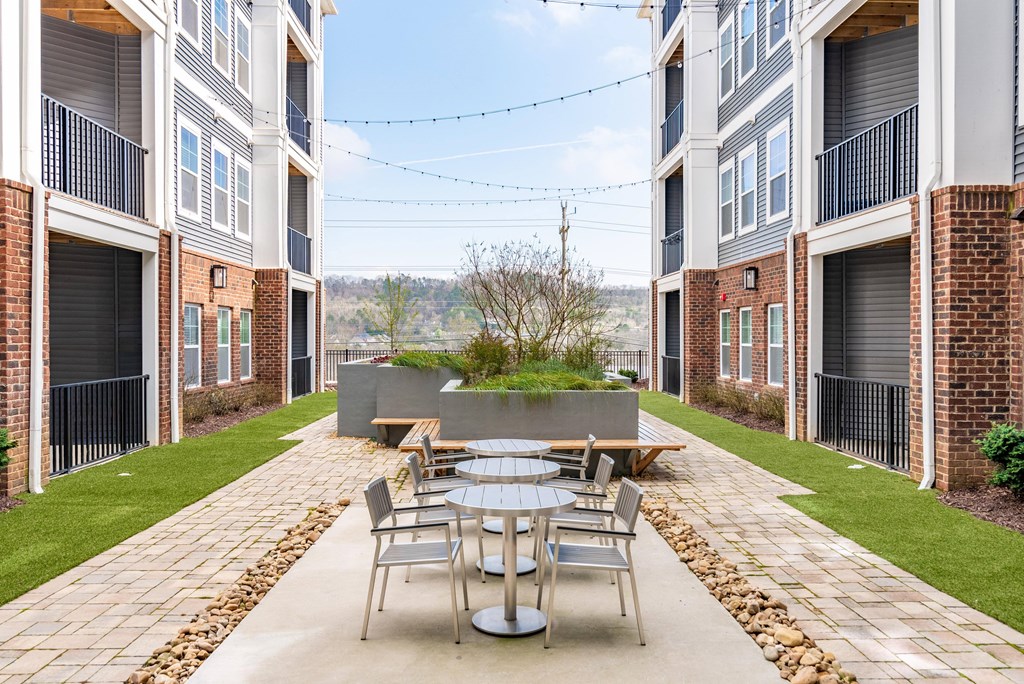 courtyard with tables and chairs apartments