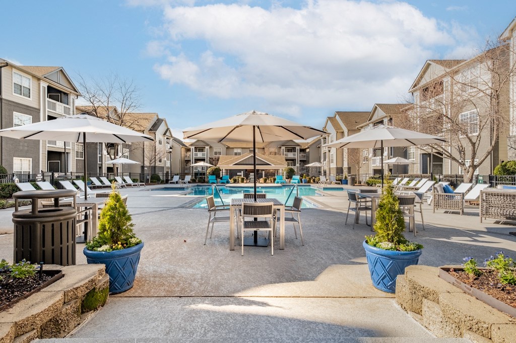 the preserve at ballantyne commons pool and patio with tables and umbrellas
