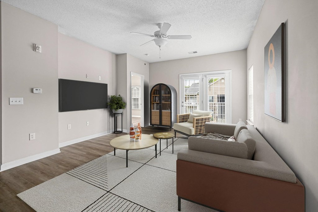 an open living room with a couch and a coffee table