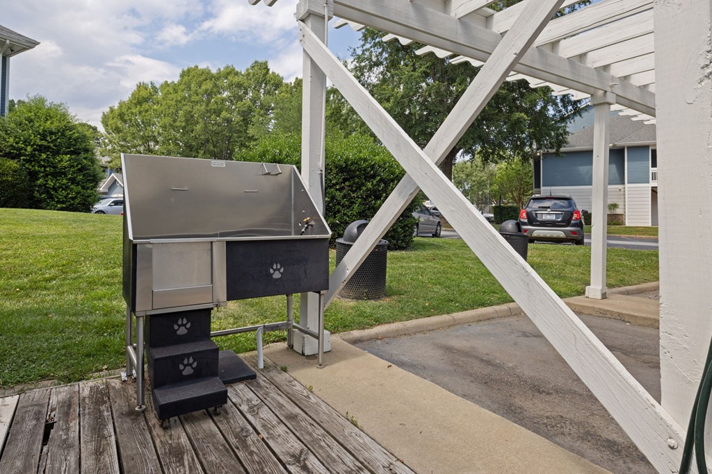 a grill on a porch in front of a house