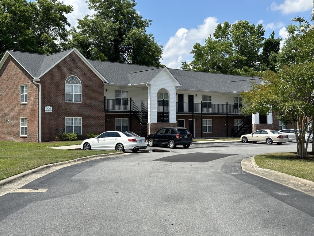 a building with cars parked in front of it