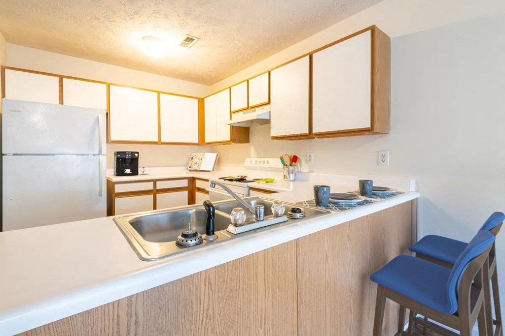 a kitchen with a sink and a counter top
