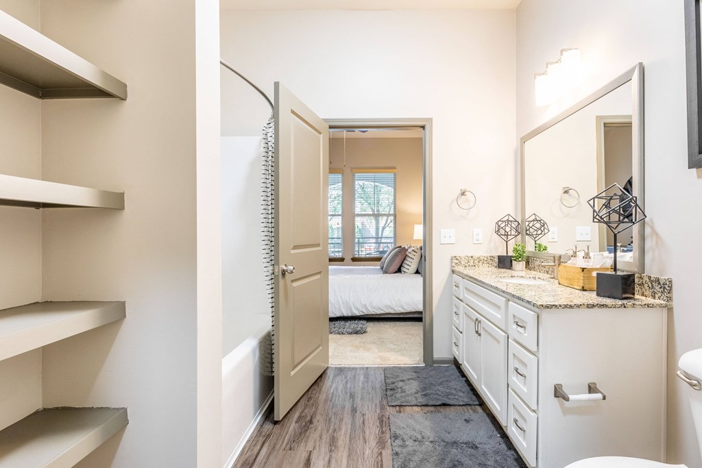 a renovated bathroom with a mirror and a closet
