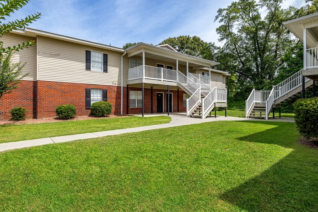 our apartments offer a spacious yard and stairs to the apartments for rent