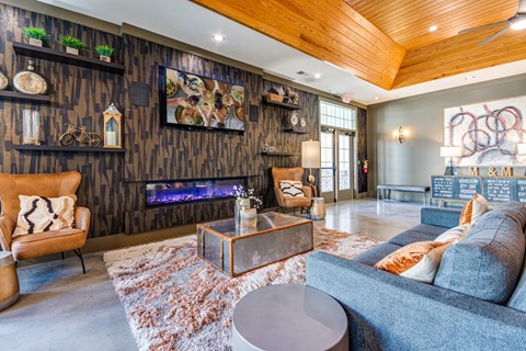 a living room with a couch and a fireplace