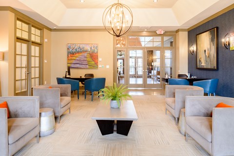 a lobby with couches and chairs and a coffee table