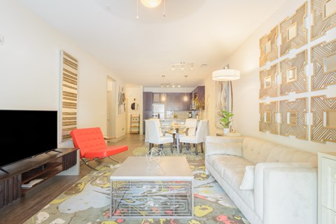 a living room with a couch and a table and a television