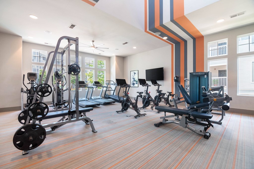 a gym with weights and cardio equipment at the resort at longboat key club