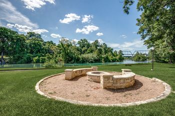 Outdoor Fire Pit by the River at Hawthorne Riverside