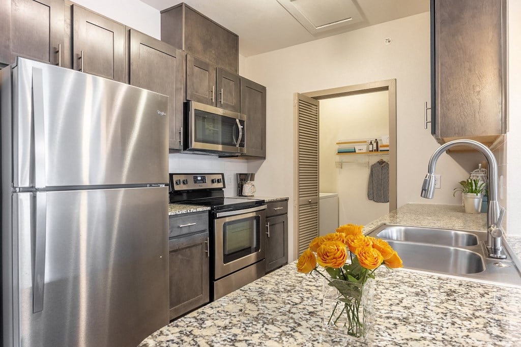 a kitchen with lights on the floor and a table