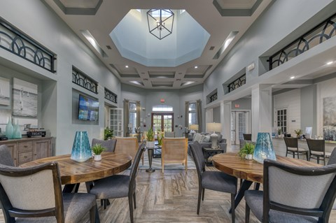 A dining room with a wooden table and chairs.