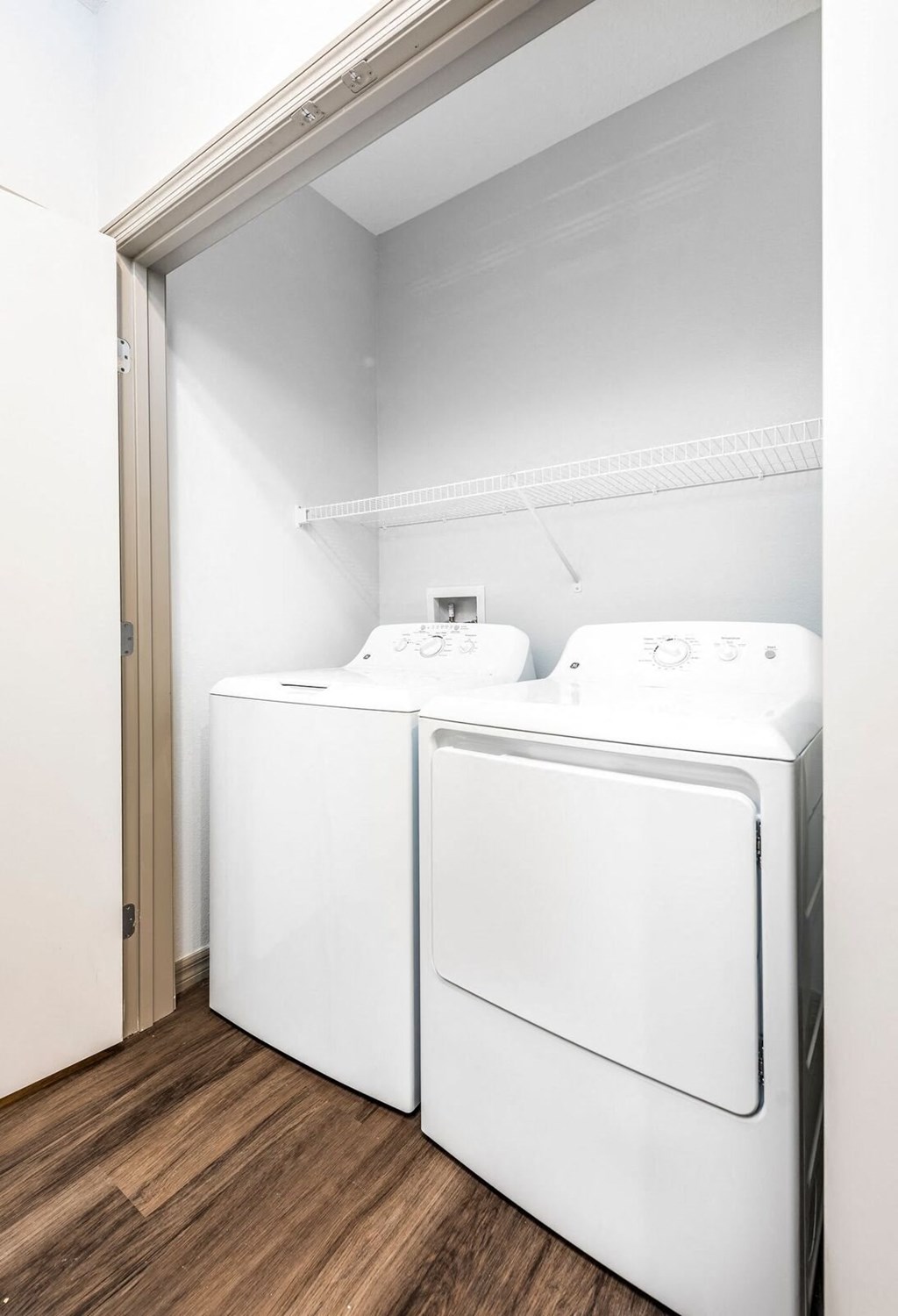a washer and dryer in a room with a door