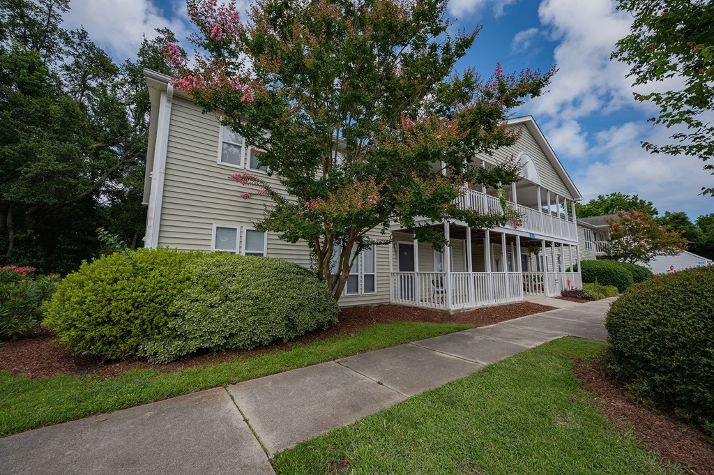a building with a sidewalk in front of it