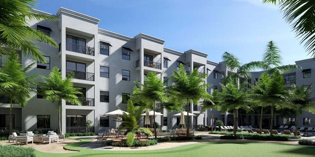 a large building with palm trees in front of it