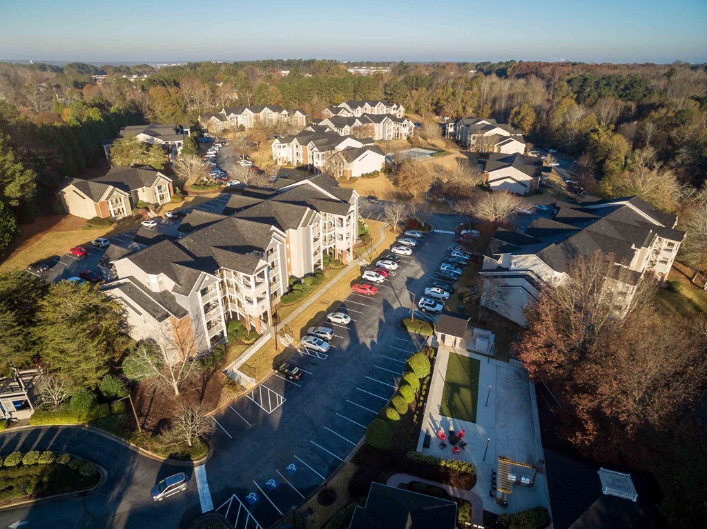 an aerial view of a neighborhood with houses and cars parked