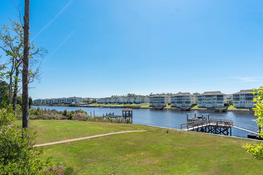 a view of a body of water with buildings and a dock