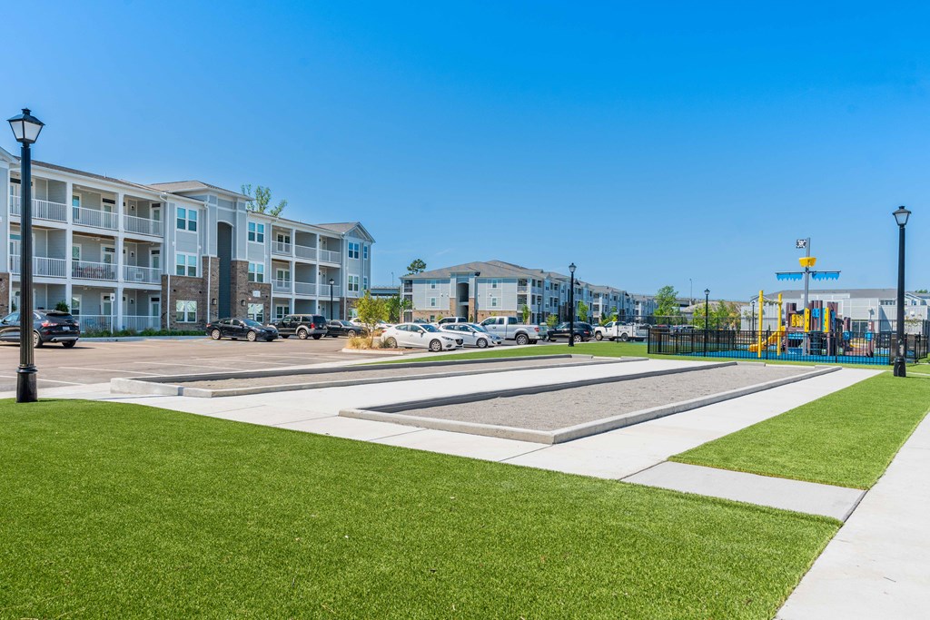 the preserve at ballantyne commons park with playground and apartment buildings