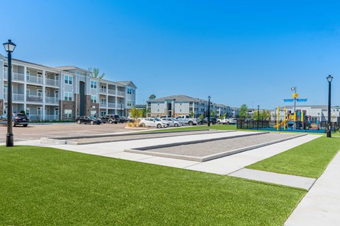 the preserve at ballantyne commons park with playground and apartment buildings