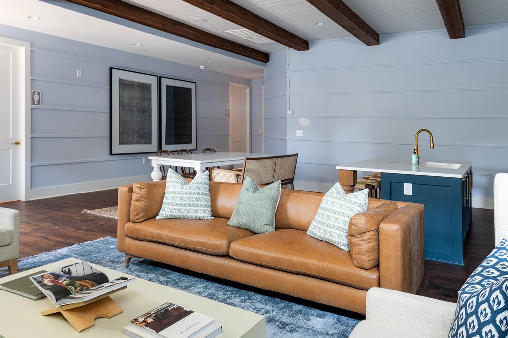 a living room filled with furniture and a large window