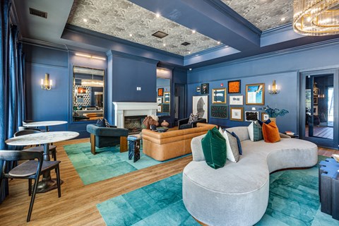 a living room with blue walls and a white couch